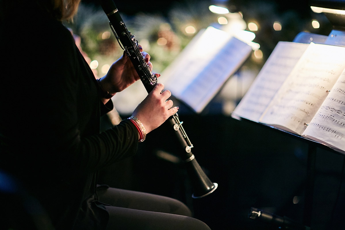 woman playing clarinet at concert
